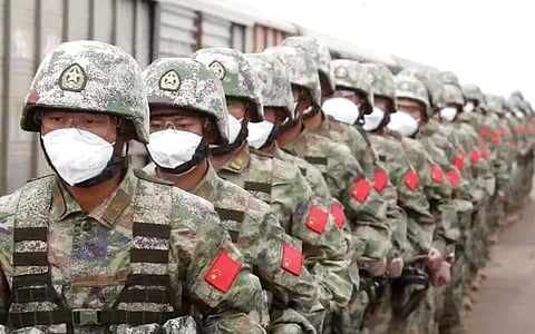 Chinese soldiers arrive to the Grodekovo railway station to participate in war games drills, in Grodekovo, Primorsky Krai, Russia. (Photo | AP)