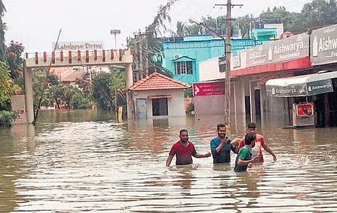 Residents of Rainbow Drive Layout in Sarjapura were forced to use a lifeboat or wade through waist-deep water | Nagaraja Gadekal, Express