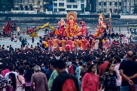 Devotees during immersion of 'Lalbaugcha Raja' idol of Lord Ganesh at Girgaon Chowpatty, in Mumbai, Saturday, Sept. 10, 2022. (Photo | PTI)