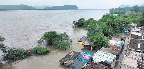 Low-lying areas on the banks of River Krishna inundated as surplus floodwater released downstream Prakasam Barrage in Vijayawada on Friday | Prasant Madugula