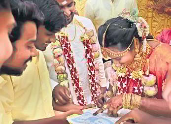 Bride signing the contract at Usilampatti on Saturday | Express