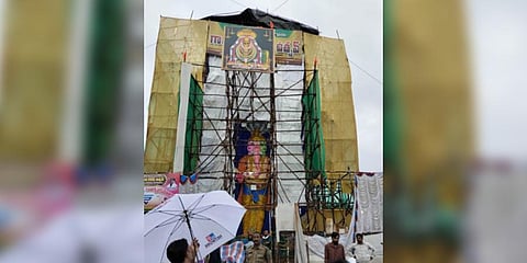 Barricades set up at the pandal to keep people 100 m away from the idol at Gajuwaka in Vizag  | Express