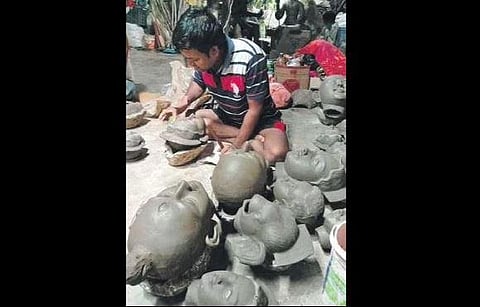 An artisan busy making idols | Express