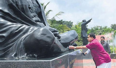 AN Shamseer pays tribute at the statue of Mahatma Gandhi in front of the assembly building, after being elected the Speaker, on Monday | Express
