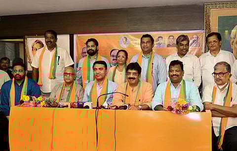 Goa Chief Minister Pramod Sawant and BJP Goa President Sadanand Shet Tanavade with eight Congress MLAs who joined the party, in Panaji. (Photo | PTI)