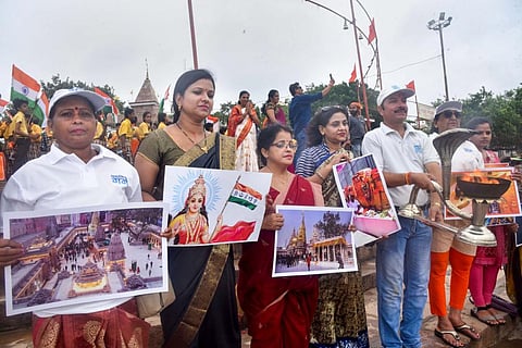 Members of Namami Gange perform 'Ganga Aarti' to celebrate after the district court's verdict in the Gyanvapi mosque-Shringar Gauri case, at Assi Ghat in Varanasi. (Photo | PTI)