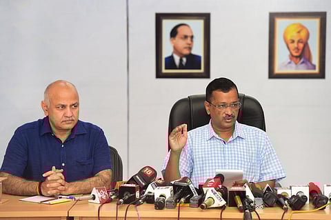 Delhi Chief Minister and AAP Convener Arvind Kejriwal speaks as Delhi Deputy Chief Minister Manish Sisodia looks on during a press conference, in New Delhi. (Photo | PTI)