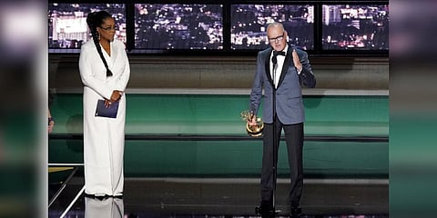 Michael Keaton, right, accepts the Emmy for outstanding lead actor in a limited or anthology series or movie for 'Dopesick' at the 74th Primetime Emmy Awards. (Photo | AP)