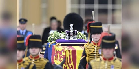 A view of the coffin of Queen Elizabeth II, adorned with a Royal Standard and the Imperial State Crown and pulled by a Gun Carriage of The King's Troop Royal Horse Artillery. (Photo | AP)