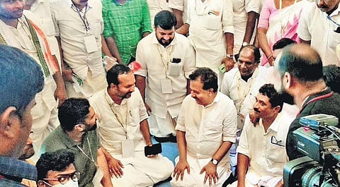 Senior Congress leader Ramesh Chennithala gives yoga tips to padayatris when they complained of aches and pains during a break at Pooja Auditorium at Mamom in Attingal on Tuesday | BP Deepu