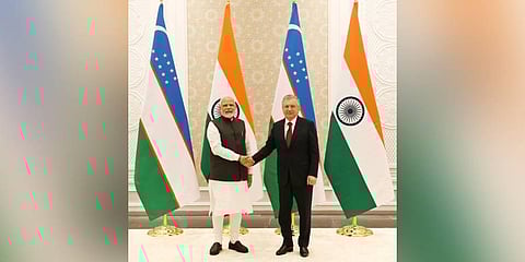 Modi meets Uzbek President Mirziyoyev . (Photo | Twitter, @narendramodi)