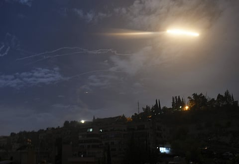 Syrian official news agency SANA, shows missiles flying into the sky near international airport, in Damascus, Syria (File Photo | AP)