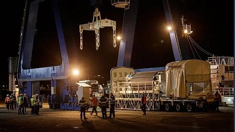 A container of radioactive Mixed Oxide Fuel (MOX) is charged onboard of a ship, at the harbour of Cherbourg-Octeville, northwestern France, in order to be sent to Japan. (Photo | AFP)