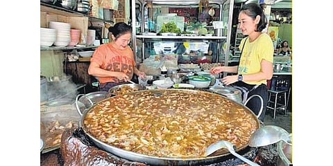 Kaweenuntawongs at work, stirring the magic soup