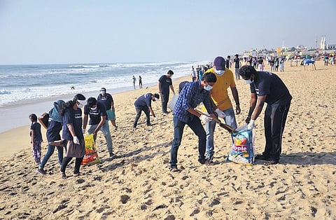 Volunteers take part in a State-level coastal clean-up drive held as part of the International Coastal Clean-up Day, at Besant Nagar beach on Saturday | Express