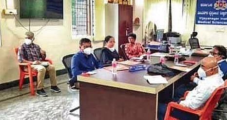 Members of a probe team hold a meeting with hospital authorities on Friday 