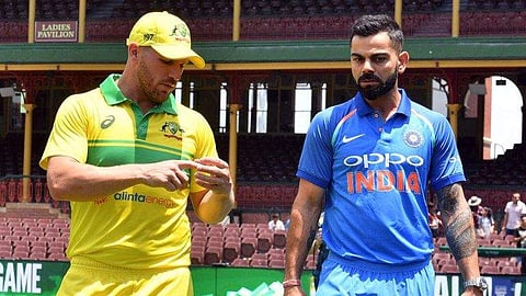 Former Australian skipper Aaron Finch (L) and Virat Kohli
