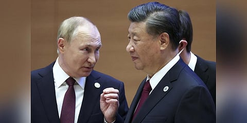 Vladimir Putin, left, gestures while speaking to Chinese President Xi Jinping during the SCO summit September.16,2022.(Photo | AP)