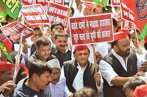 Samajwadi Party President Akhilesh Yadav with party leaders during a march from party office to UP Vidhan Bhavan, on the first day of Monsoon Session of UP Assembly, in Lucknow, Monday. (Photo | PTI)