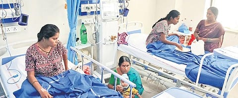 Family members attend to women   who were admitted in NIMS, on Thursday | Vinay Madapu