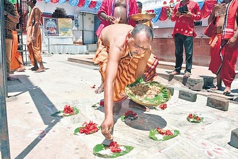 A woman preparing pitha in Sambalpur; a priest performing a ritual at a temple in Sambalpur | Express