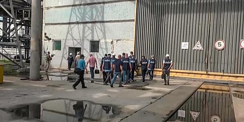 In this handout photo taken from video released by Russian Defense Ministry Press Service, members of IAEA walk while inspecting the Zaporizhzhia Nuclear Power Plant. (Photo | AP)