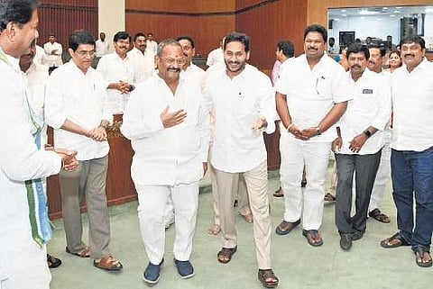 CM Jagan Mohan Reddy and other ministers accompany the newly-elected Deputy Speaker Kolagatla Veerabhadra Swamy up to his chair in the State Assembly at Velagapudi on Monday | Express