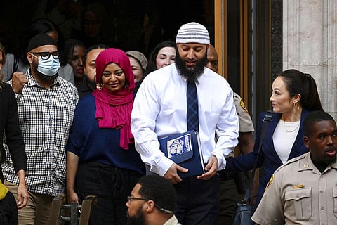 Adnan Syed, center right, leaves the courthouse after the hearing, Monday, Sept. 19, 2022, in Baltimore.(Photo | AP)