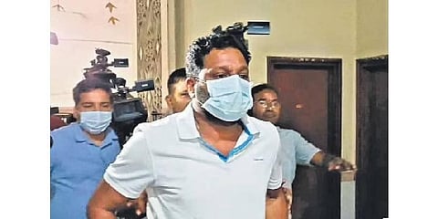 Builder Srinivasa Rao  being taken to the ED office for questioning for  his alleged links to Robin Distilleries of Ramachandran Pillai, one of the accused in the Delhi liquor scam case
