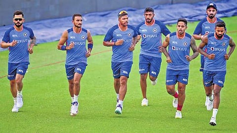 Indian players warm up during a practice session ahead of the first T20I against Australia in Mohali, on Monday | PTI