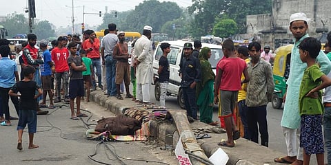 Rugs and blankets belonging to homeless people lie on a road, after a speeding truck mowed down people sleeping on a road divider at Seemapuri area, in New Delhi, Wednesday. (Photo | PTI)