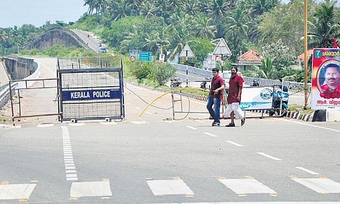 Police barricades kept on one side of the entrance of Kovalam-Mukkola section of NH-66 bypass at Kovalam junction in Thiruvananthapuram on Tuesday | B P Deepu