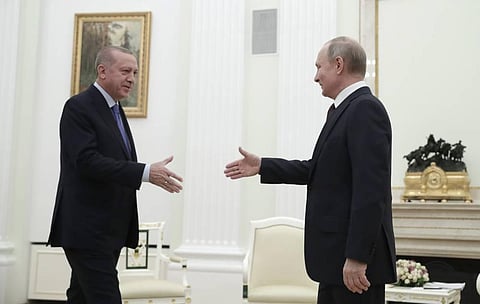 Russian President Vladimir Putin, right, and Turkish President Recep Tayyip Erdogan greet each other prior to their talks at the Kremlin in Moscow in March, 2022. (File Photo | AP)