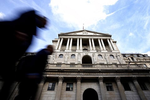 Pedestrians walk past The Bank of England in London, Thursday, Sept. 22, 2022.