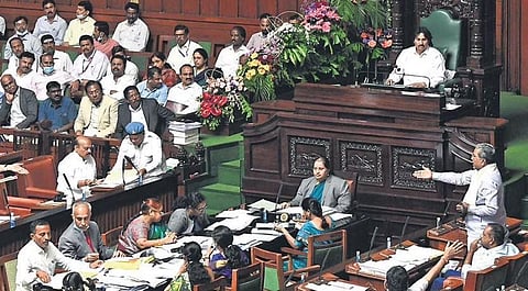 Leader of Opposition Siddaramaiah and Revenue Minister R Ashoka debate in the Assembly, as Chief Minister Basavaraj Bommai looks on, in Vidhana Soudha on Wednesday | Nagaraja Gadekal