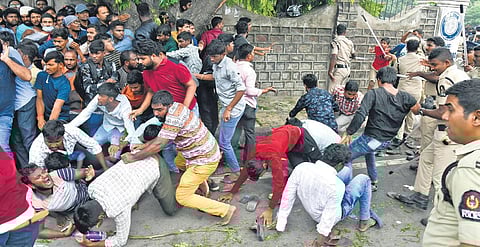 Police personnel swing into action to bring the situation under control following the stampede at the Gymkhana Grounds on Thursday | Vinay Madapu