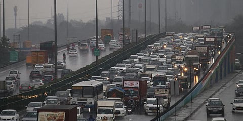Vehicles stuck in a traffic jam on the water-covered Delhi-Gurugram Expressway amid rainfall, in Gurugram.(Photo |PTI)