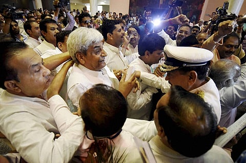 In this file image, BJP MLAs scuffle with Opposition Congress MLAs over Vyapam scam at Madhya Pradesh assembly in Bhopal. (Photo | PTI)