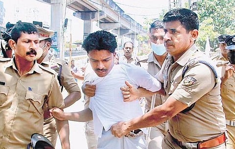 Police officers take away a hartal supporter who tried to forcibly shut down shops in the city | Express