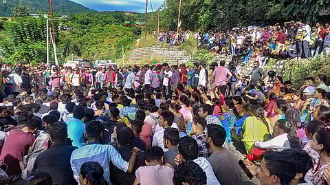 Protestors block the Rishikesh-Badrinath national highway in Uttarakhand's Shrinagar area on Sunday over the death of 19-year-old receptionist Ankita Bhandari. (Photo | PTI)