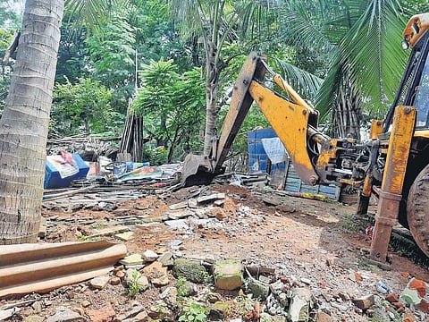 Encroachments being removed from railway land in Visakhapatnam I express