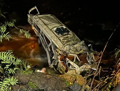 A tourist vehicle rolled down from a cliff on NH-305 in Ghiyagi area of Banjar Valley in Kullu on Sunday. (Photo | ANI Twitter)