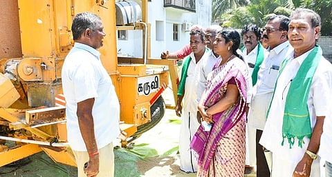 Mayiladuthurai Collector R Lalitha studying the demonstration of a mobile grain dryer in Sankaranpandal | Express
