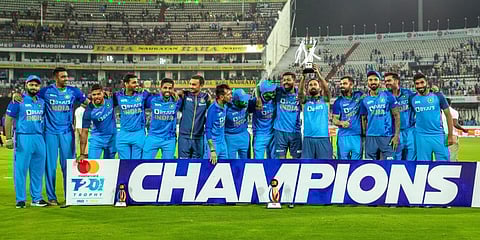 Indian players pose for photos with the trophy after winning the 3rd and final T20 cricket match of the series against Australia.(Photo | PTI)