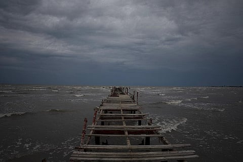 Waves kick up under a dark sky along the shore of Batabano, Cuba. (Photo | AP)