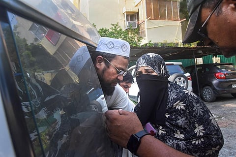 Aneesh, an accused detained during a raid by Special Cell of the Delhi Police for his alleged association with Popular Front of India (PFI), at Amar Colony police station, in New Delhi. (Photo | PTI)