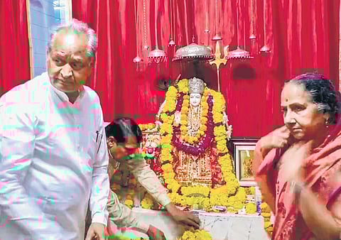 Rajasthan CM Ashok Gehlot offers prayers at his residence in Jaipur on Monday. (Photo| PTI)