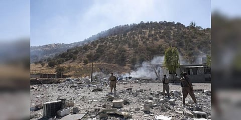 Members of exiled Komala Party inspect aftermath of bombing in the village of Zrgoiz, near Sulaimaniyah, Iraq, where the bases of several Iranian opposition groups are located. (Photo | AP)