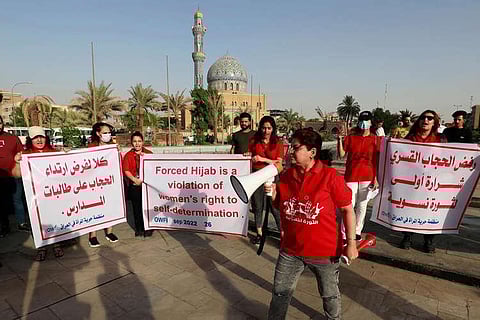 Iraqi women protest at al-Fardoos square in Baghdad in solidarity with Iranian women after the death of Mahsa Amini and against imposing wearing a headscarf on women.(Photo | AFP)