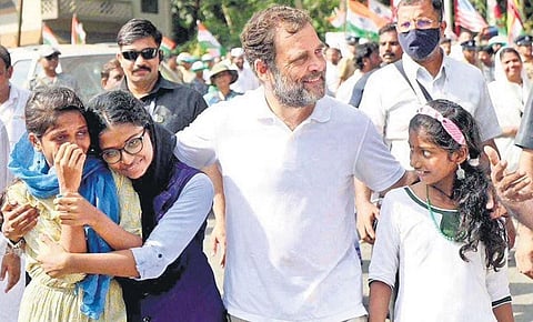 Congress leader Rahul Gandhi walks with children during Bharat Jodo Yatra in Malappuram on Tuesday